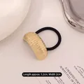 Gold bamboo texture metal hair tie with black elastic band, length 5.2cm width 2cm - Curved Bamboo Pattern Gold