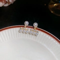 Macro detail of elegant gold-plated pearl and zircon earrings on ceramic plate - Fan-shaped Pearl Rhinestone Earrings / 24# Gold (Real Gold Plated)