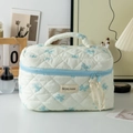 Quilted cream cosmetic bag with light blue bow print and portable handle - Large White with Blue Bow