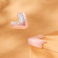 Paraspigoli in silicone rosa a forma di L per la sicurezza dei bambini su mobili e tavoli - Forma a L Rosa