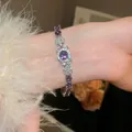 Elegant zircon flower bracelet with a stunning purple center stone shown on a model's wrist - Floral Geometric Style (9#)