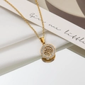 Elegant gold tree of life necklace with pavé zircon stones on white silk background - Tree of Life