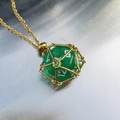 Green translucent dice pendant in gold mesh cage with a matching gold chain necklace - Gold Cage with Green Dice