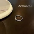 Minimalist silver moon ring featuring circular and marquise zircons in a zircon style - Butterfly Bow