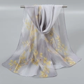 Detail of light gray floral chiffon scarf featuring yellow leaf prints on metal rod - Grey (Yellow Branches)
