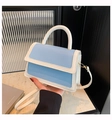 Chic light blue and cream contrast handbag with a top handle and adjustable strap - Blue