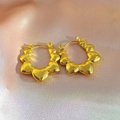 Golden heart-shaped hoop earrings featuring a continuous multi-heart pattern design - Multiple Hearts Hoop Style (EH270)