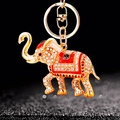 Golden elephant keychain with sparkling crystals and red enamel detail on dark background - Single OPP Bag Packaging / Red Elephant Style C