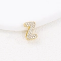 Detailed macro view of a gold-plated Z-shaped pendant encrusted with sparkling white zircons - Z (Single Pendant)