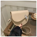 Detail of beige PU leather saddle bag with silver metal clasp and adjustable strap - Khaki