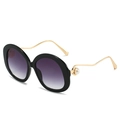 Lunettes de soleil rondes avec verres dégradés violets et branches dorées perlées - Monture Noire Verre Gris Dégradé