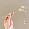 Golden Chinese hair pin with magnolia flowers, pearls and flowing tassels detail - Pearl Flower