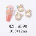 Detailed view of smiling face bowknot nail charms with aurora rhinestones and gold alloy - Aurora Light (AB90)