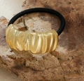 Detail of golden wavy textured metal ornament on black elastic ponytail holder - Style 3-Wrapped Ribbed