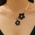 Golden flat snake chain necklace featuring elegant black flower pendants and toggle clasp - Gold Snake Chain Necklace with Black Flowers (6129)