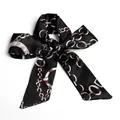 Elegant black silk ribbon scarf featuring red and white metal chain print tied in a bow - S56-Black Paris Chain