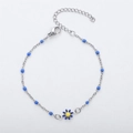 Detailed view of silver bead chain bracelet featuring blue daisy pendant and lobster clasp - Steel + Royal Blue