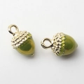 Detail of golden acorn charms with green resin and metal texture for DIY jewelry - Acorn Shape / Green Acorn