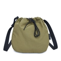 Olive green nylon drawstring bucket bag with adjustable black shoulder strap and texture - Green