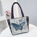 Canvas tote bag with blue butterfly embroidery and ethnic woven handles for women - Butterfly 1