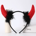 Detail view of red devil horn headband with black feather trim for Halloween costume - Red Felt Horns + Black Feather + Black Headband