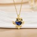 Golden owl pendant necklace with a large blue gem and sparkling crystal micro-pave details - Gold Owl/Deep Blue Large Gem