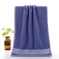 Purple cotton towel with five white horizontal stripes and soft terry cloth texture - Comfy Stripe Blue