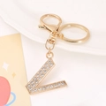 Detailed view of the sparkling gold L letter keychain featuring clear rhinestones - Letter V