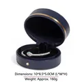 Navy blue faux leather jewelry box featuring a luxury snake bangle with zircon accents - Blue Bangle Box