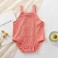 Pink ribbed cotton baby bodysuit with wide straps and a front pocket on white background - 66CM / Light Orange