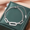 Silver titanium steel chain bracelet featuring three interlocking rings with sparkling crystals - Silver