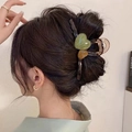 Elegant large shark hair claw clip with green and amber resin hearts in hair - Double Green Hearts