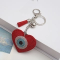 Sparkling red heart keychain with evil eye rhinestones, red tassel and silver bell detail - Red