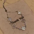 Pulsera trébol plateada con nácar blanco y detalles pavé brillantes de alta moda - Pulsera Ajustable De Trébol De Concha / Plateado