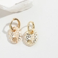 Macro detail of oval gold-tone earrings with white enamel and golden geometric grid - White (ES2620-1)
