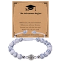 Close-up of natural white turquoise beads with silver compass charm on a graduation gift card - Adventure Begins / Howlite