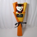 Close-up of a graduation plush bear in black gown with yellow sunflower soap bouquet - Orange