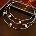 Irregular silver wave choker with five baroque pearls on a leather tray display - 9# European American Statement Versatile Pearl Choker