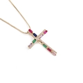 Macro shot of gold cross pendant necklace featuring colorful zircon stones and tiny crystals - Multi-color Rectangular Stone Cross Style (00647-CX)
