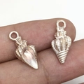 Silver conch shell charms for DIY jewelry making featuring intricate metal textures - White Conch