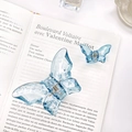 Light blue transparent butterfly hair claw clips in large and small set on book background - Large & Small Set / Grey Blue