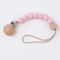 Baby pacifier clip with pale pink silicone beads and octagonal beech wood bead detail - Style 87 Green/Beige Stripes