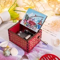 Handcranked wooden music box with festive red gold vine patterns and Santa illustration - Christmas 18/Red/Christmas Truck Illustration