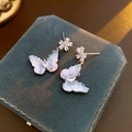 Detail of silver butterfly earrings with zircons on a green velvet jewelry box - Zircon Flower Butterfly Stud Earrings