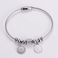 Bracciale a cavo in acciaio argento con ciondoli moneta Regina Elisabetta e strass - Color Acciaio