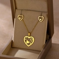 Close-up of golden heart jewelry set with LOVE lettering in a brown gift box - LOVE Heart (TZ-408)