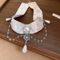 Elegant beige velvet choker featuring a crystal snowflake pendant and pearl teardrop - Rhinestone Snowflake Pearl Choker