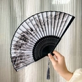 Bamboo folding fan with black and white ink landscape painting and black silk tassel - Black and White Ink Wash Jiangnan Water Town Style (Women's Fan)