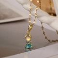 Gold plated princess pendant necklace with blue and yellow zircon stones on white display - Cartoon Princess / 23929