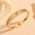 Detail of gold titanium steel bangle featuring heart-shaped zircon and pave crystals - Gold Heart Inlaid Diamond Style (M611)